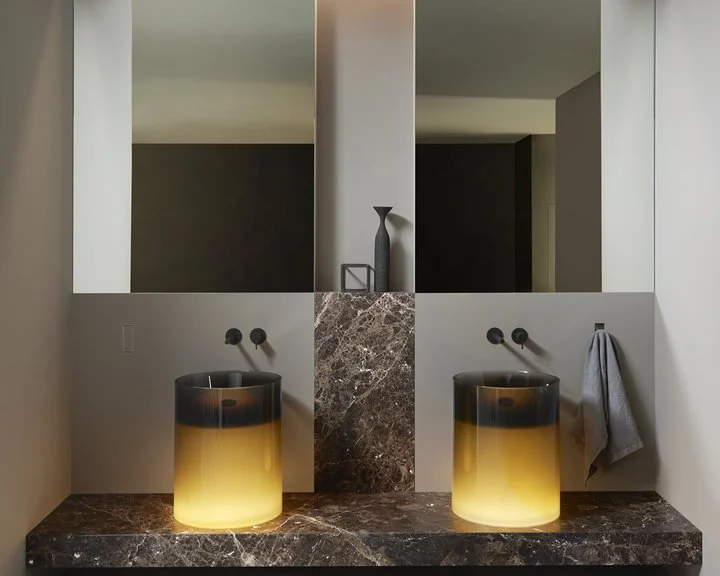 Two illuminated Breeze sinks in bronze Cristalmood by Antoniolupi